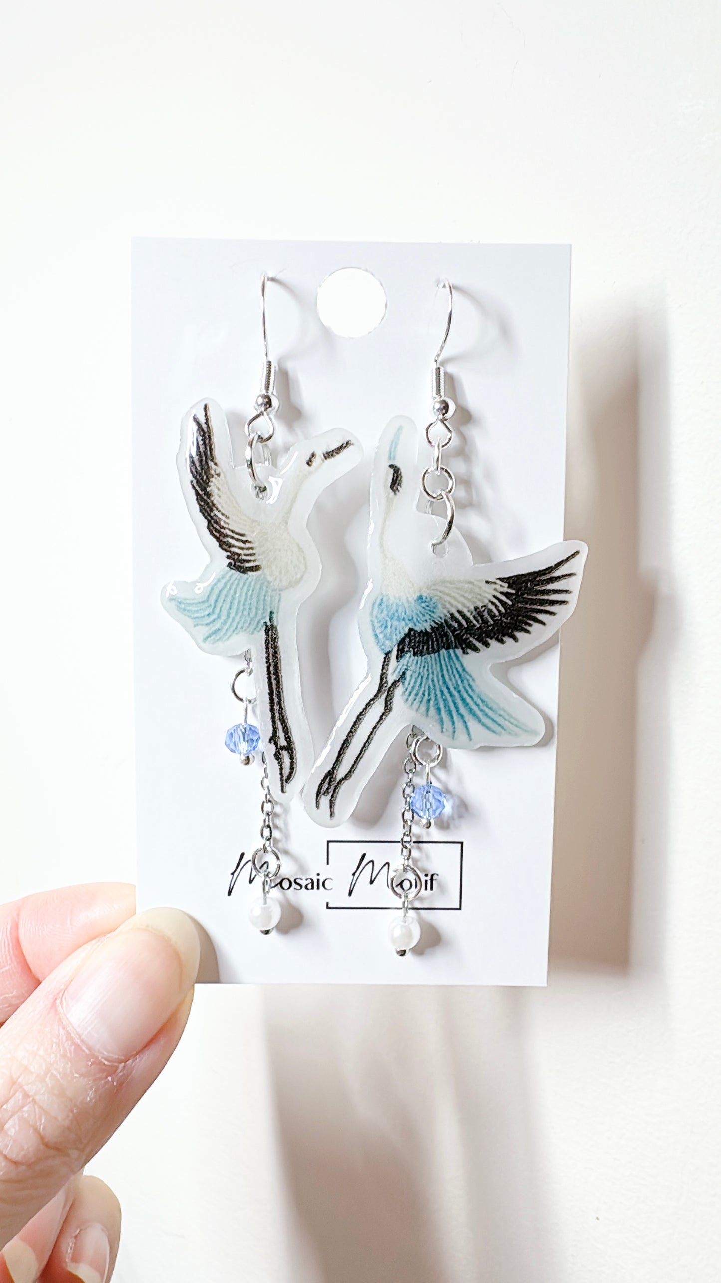 Crane dangle earrings